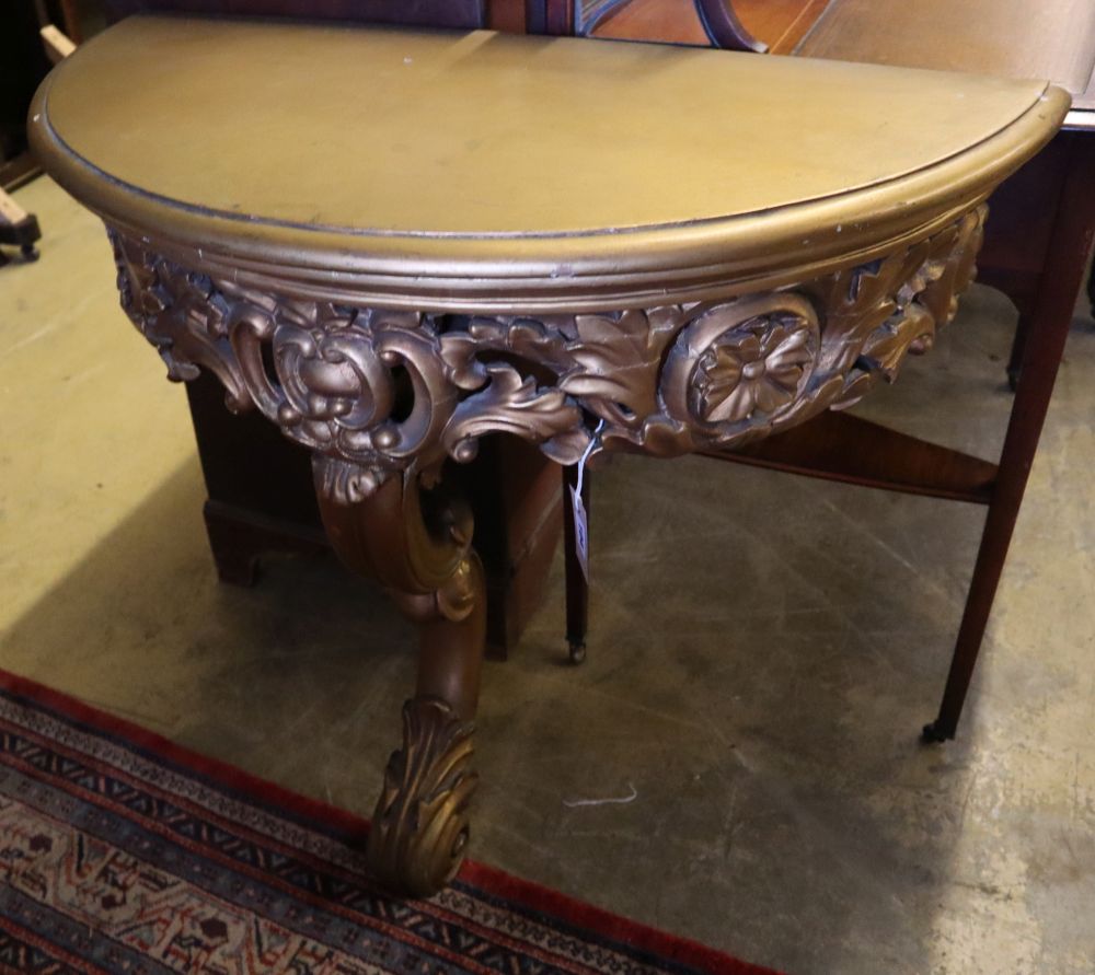 An 18th century design gilt D shaped console table, width 86cm, depth 42cm, height 75cm